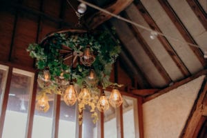 The inside of the barn at Ufton Court, featuring a chandelier