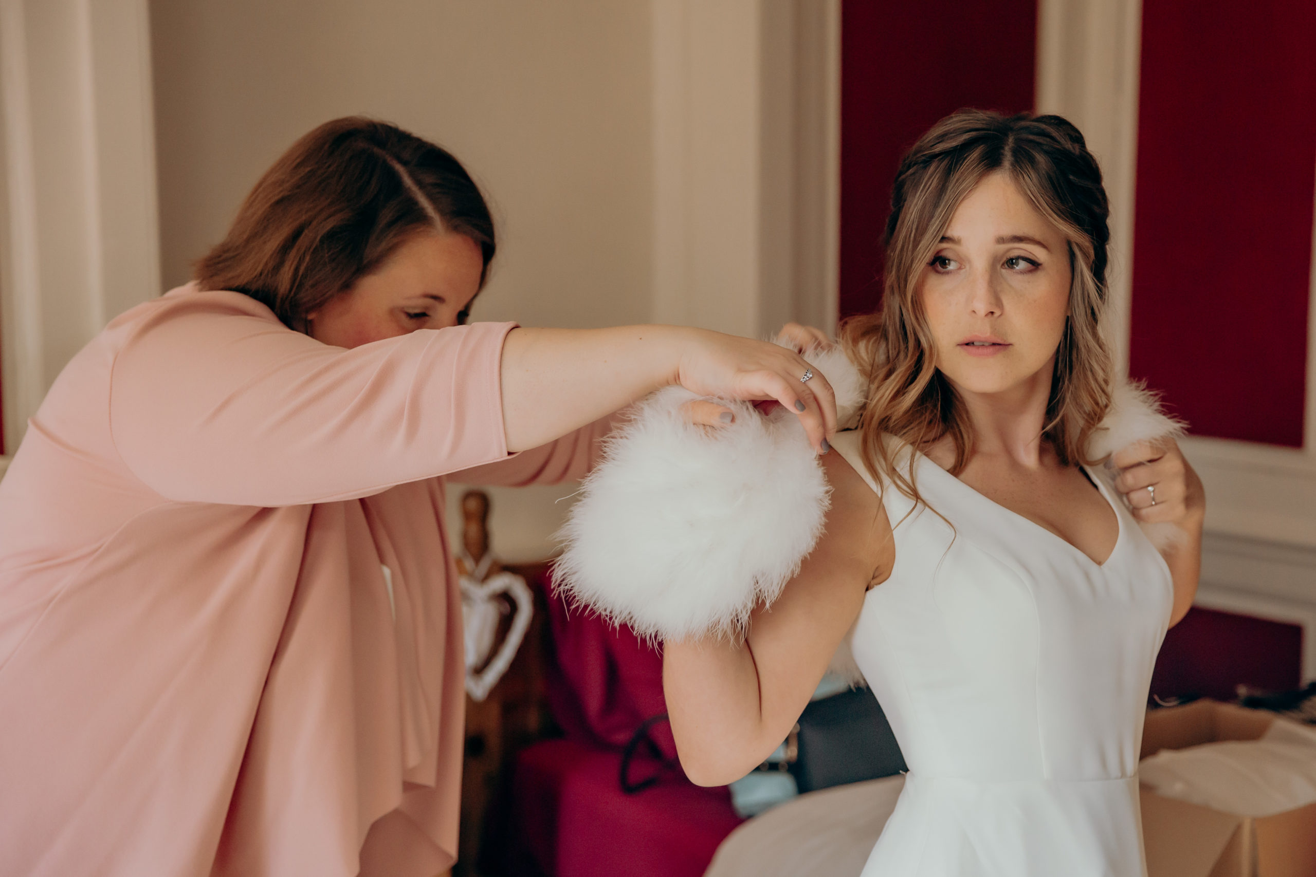 Lisa's sister helping her get ready on her wedding day