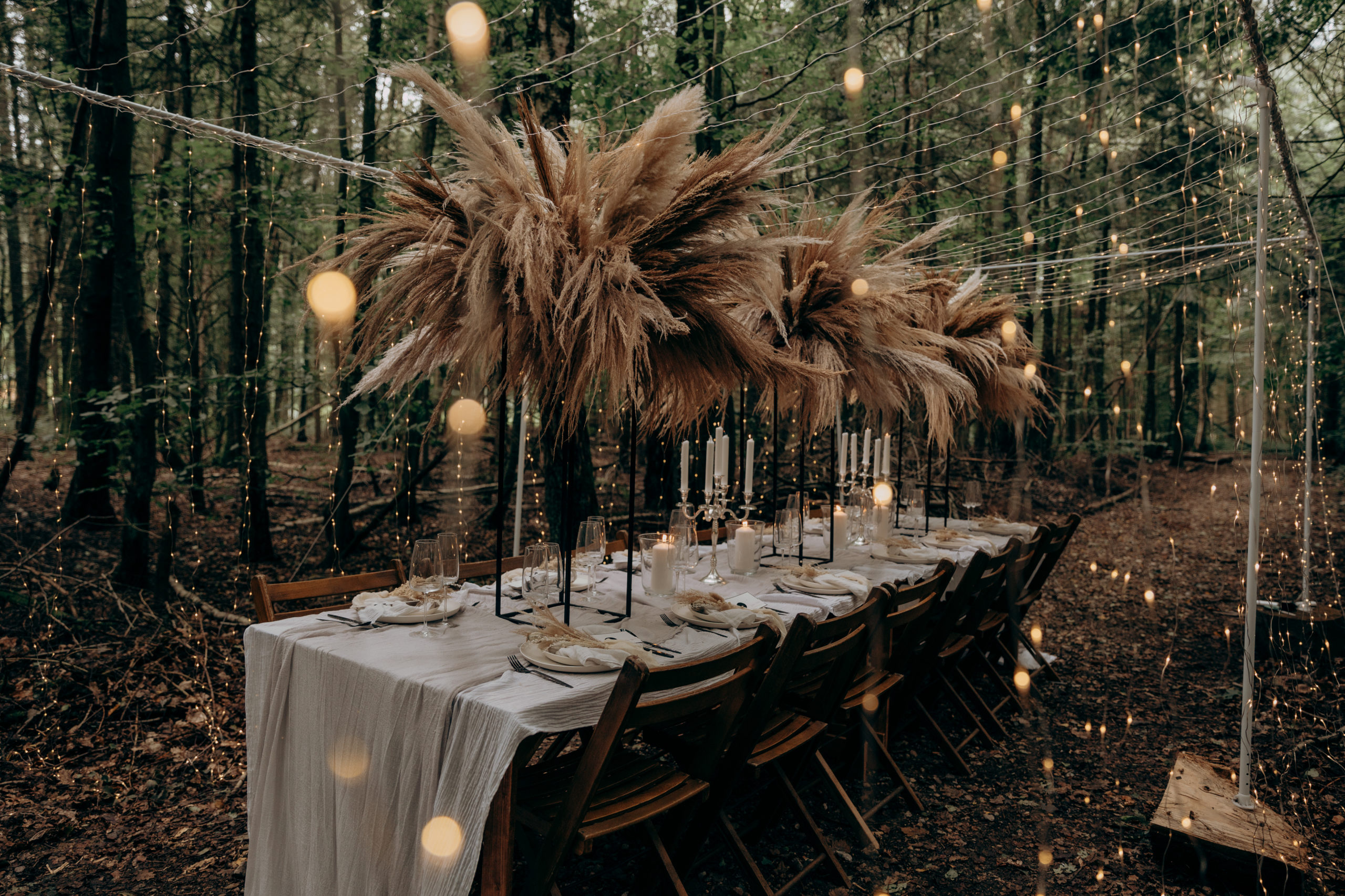A luxurious boho table setup in the trees at Longton Wood