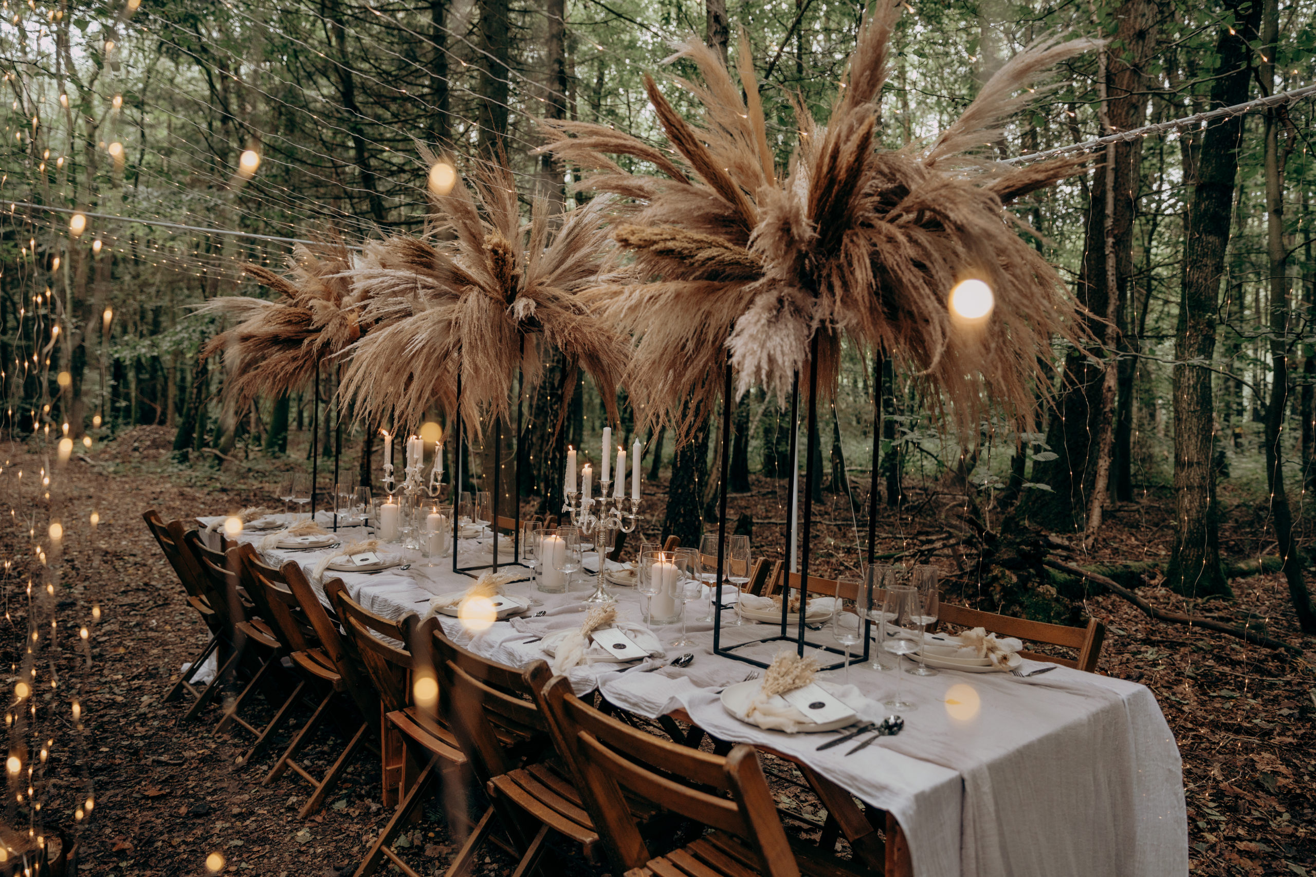 A luxurious boho table setup in the trees at Longton Wood