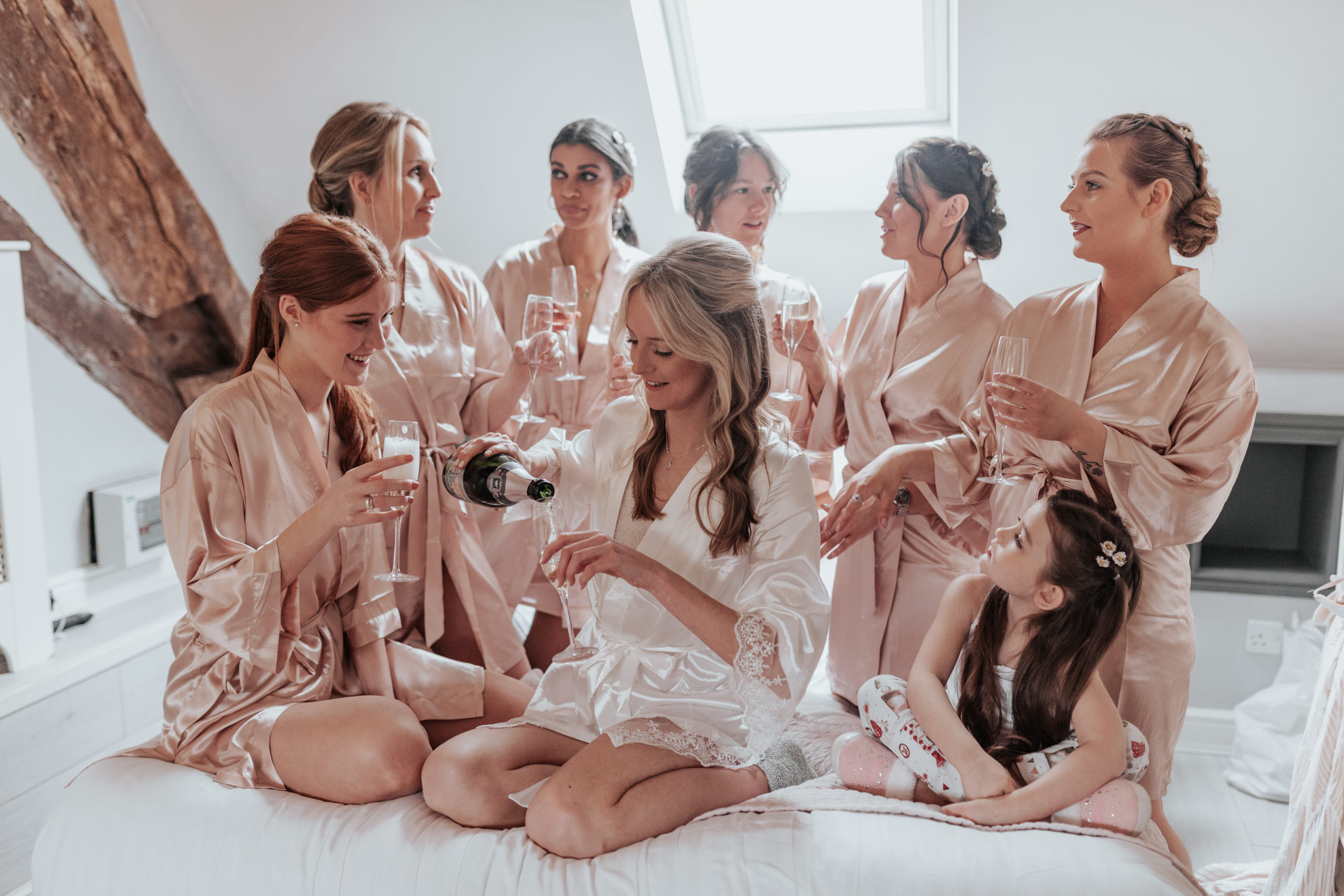 Sinead and her bridesmaids getting ready while drinking champagne in matching pyjamas