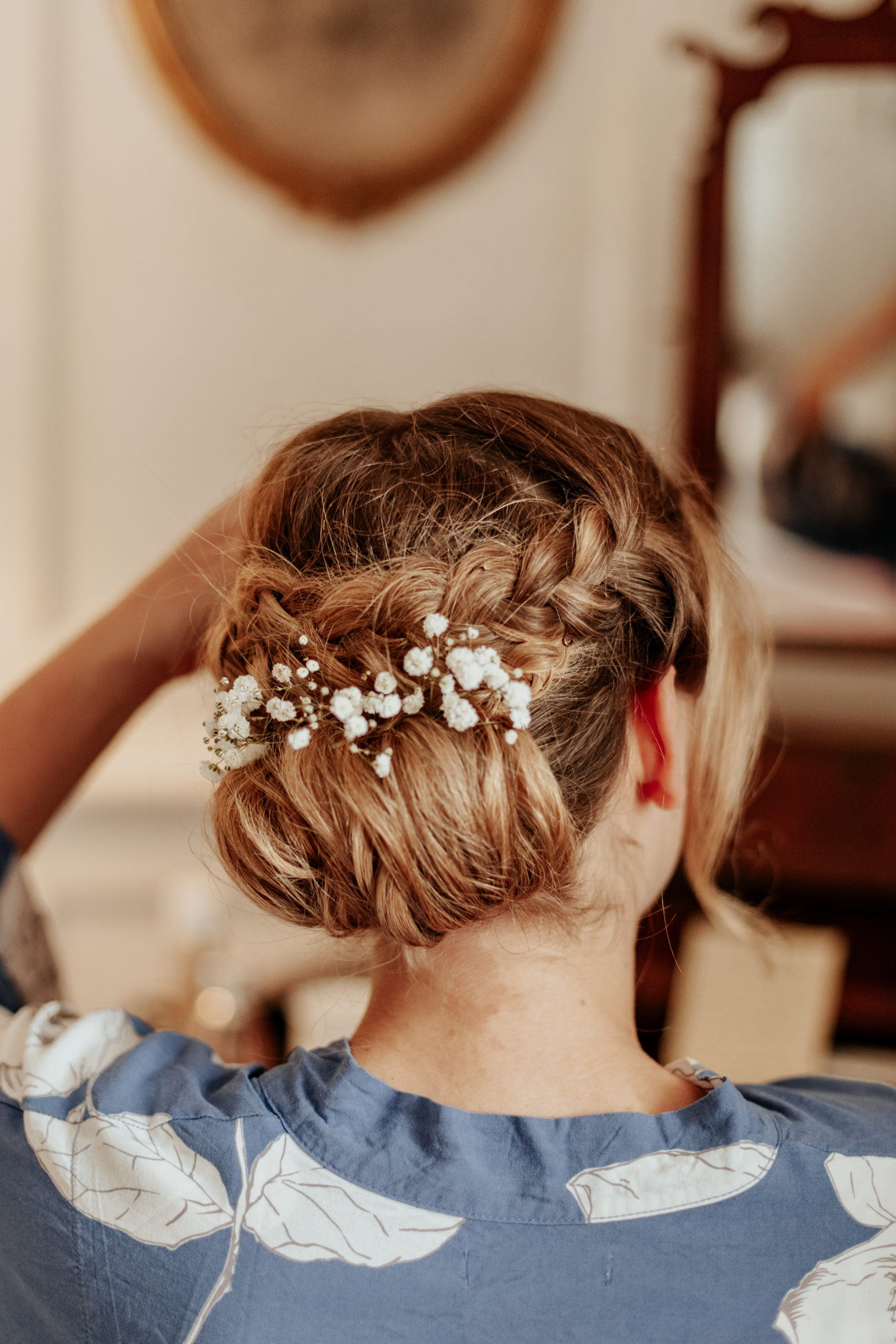 Sarah&#039;s braided bun, with flowers woven into it