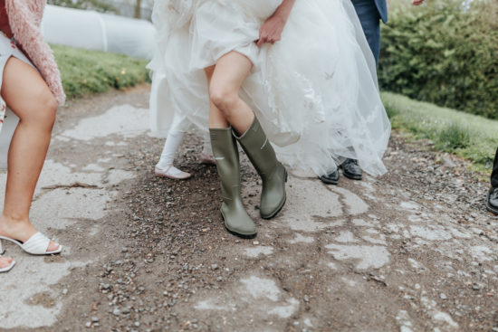 Sinead shows off her wellies during the bad weather at her winter wedding