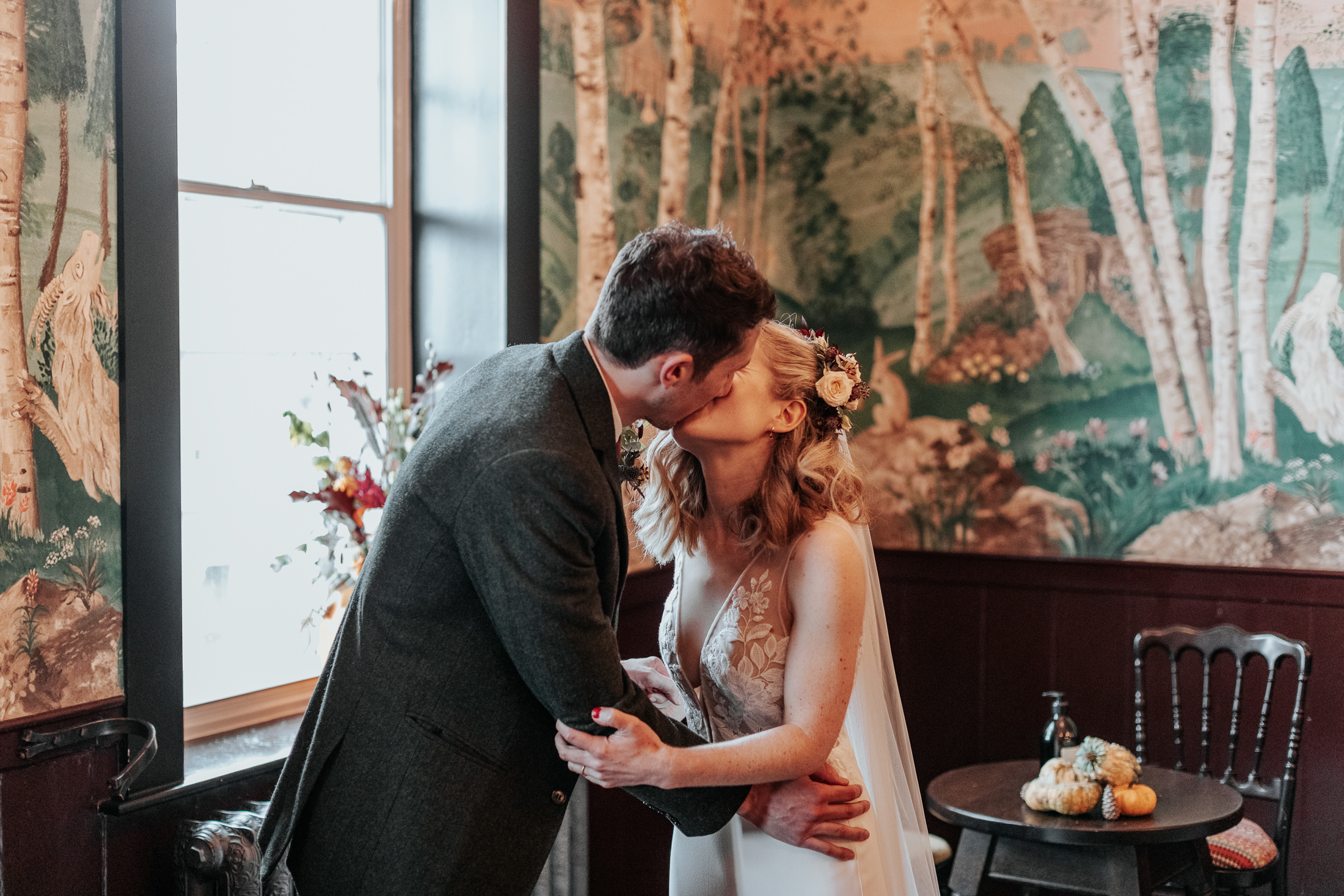 Bride and groom kiss at the end of their wedding ceremony