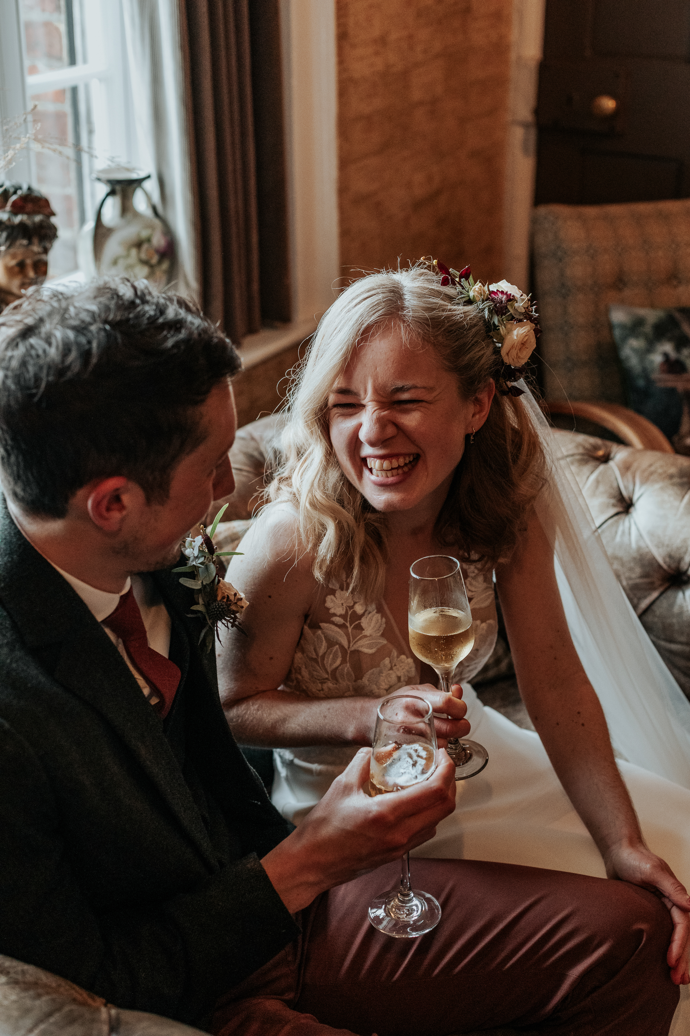 Maddie and Will drink champagne together by the fireplace