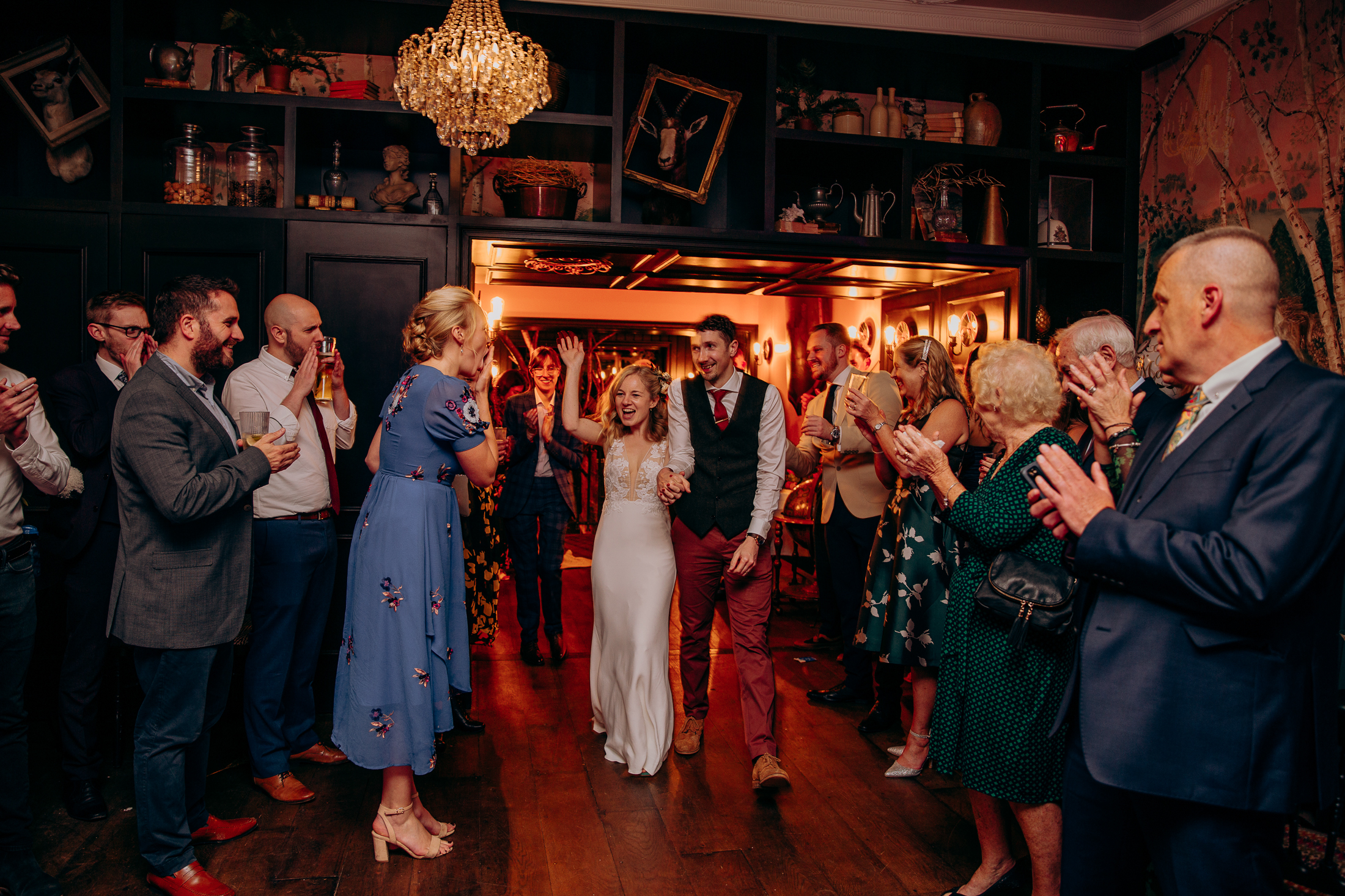 Maddie & Will are welcomed onto the dance floor by their wedding guests who have formed a tunnel
