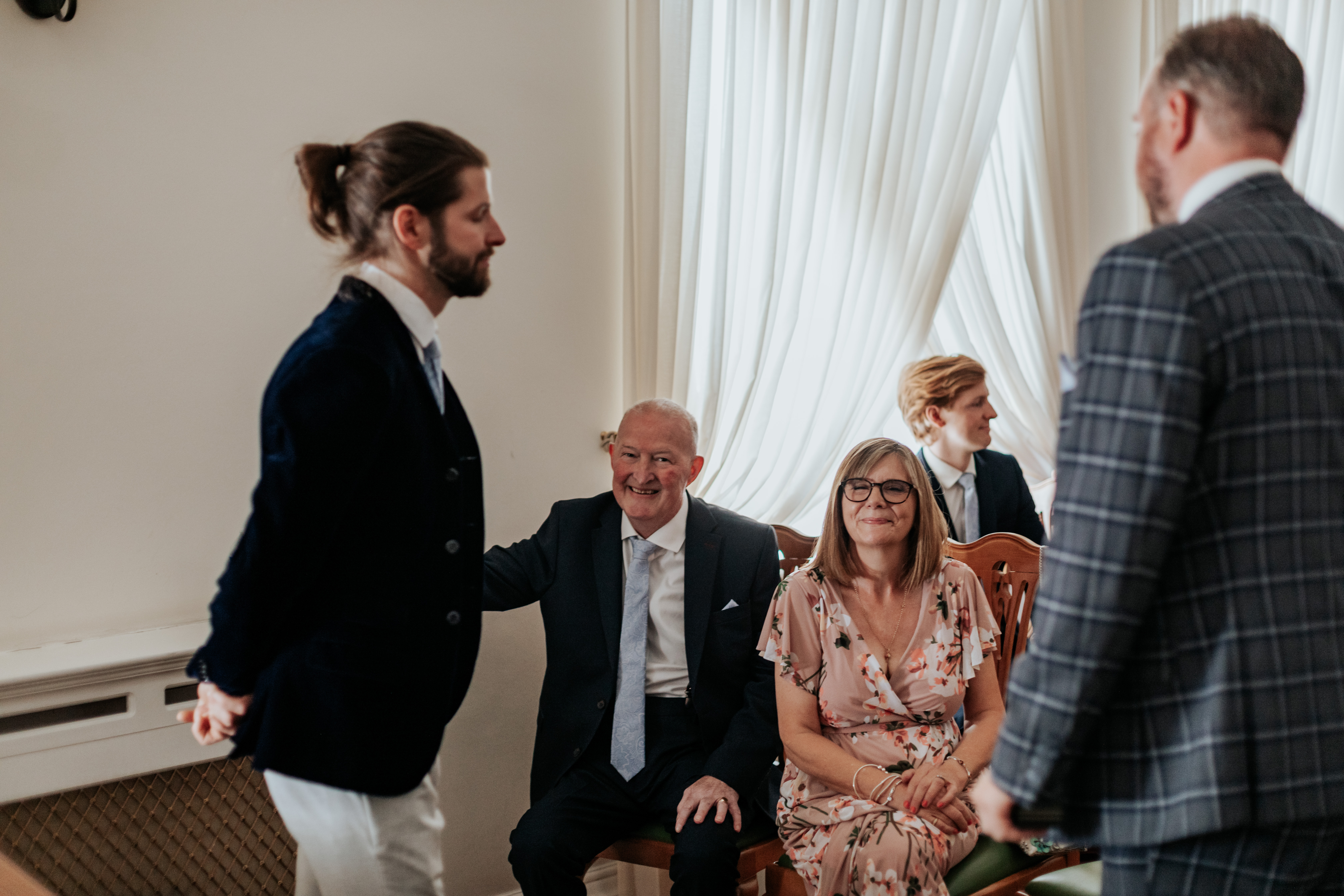 HannahSam25_07-015 Groom waits with his family in the Edwardian Room of Woolwich Town Hall