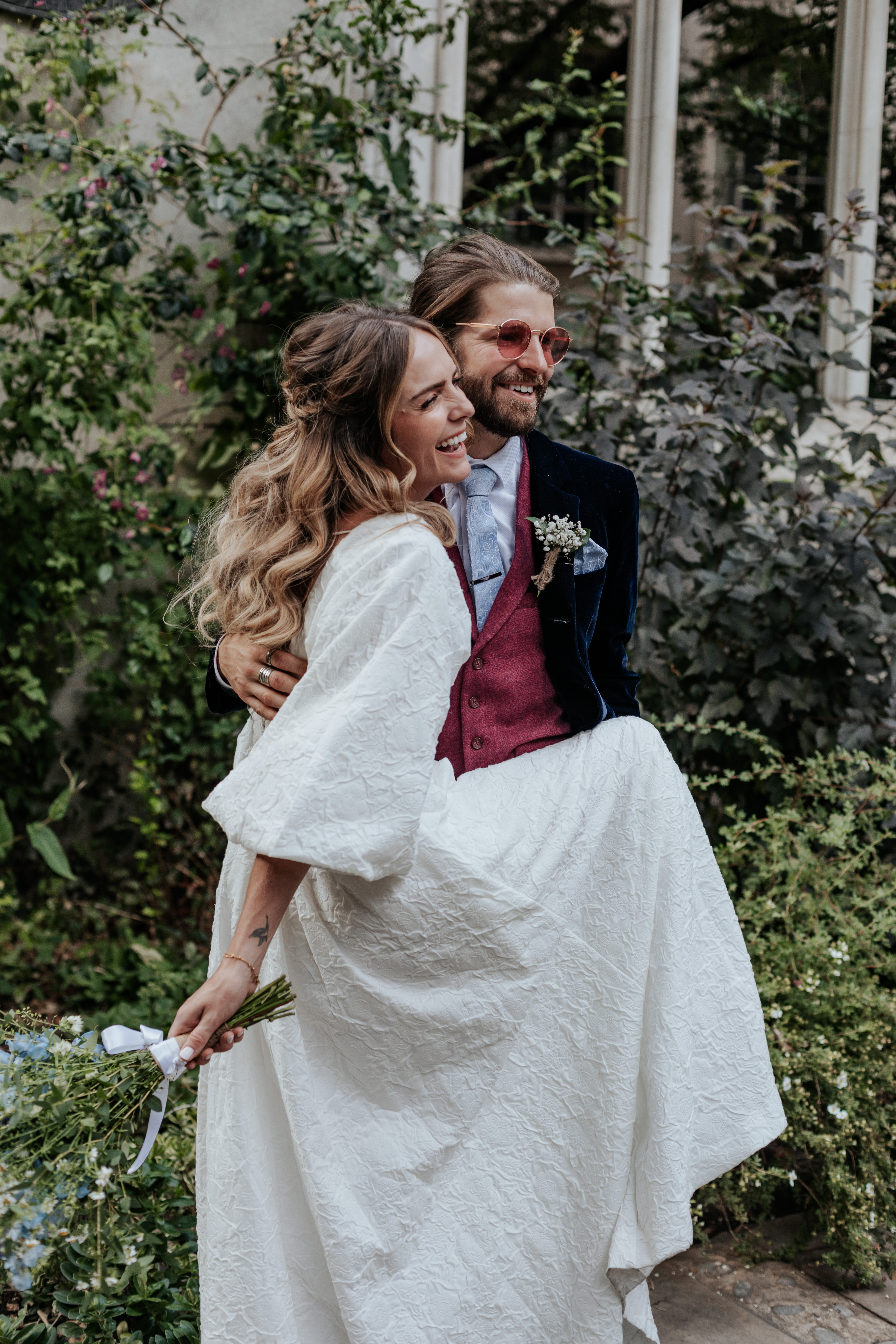 HannahSam25_07-248 Bride and groom embrace at St Dunstans in The East gardens during their London wedding
