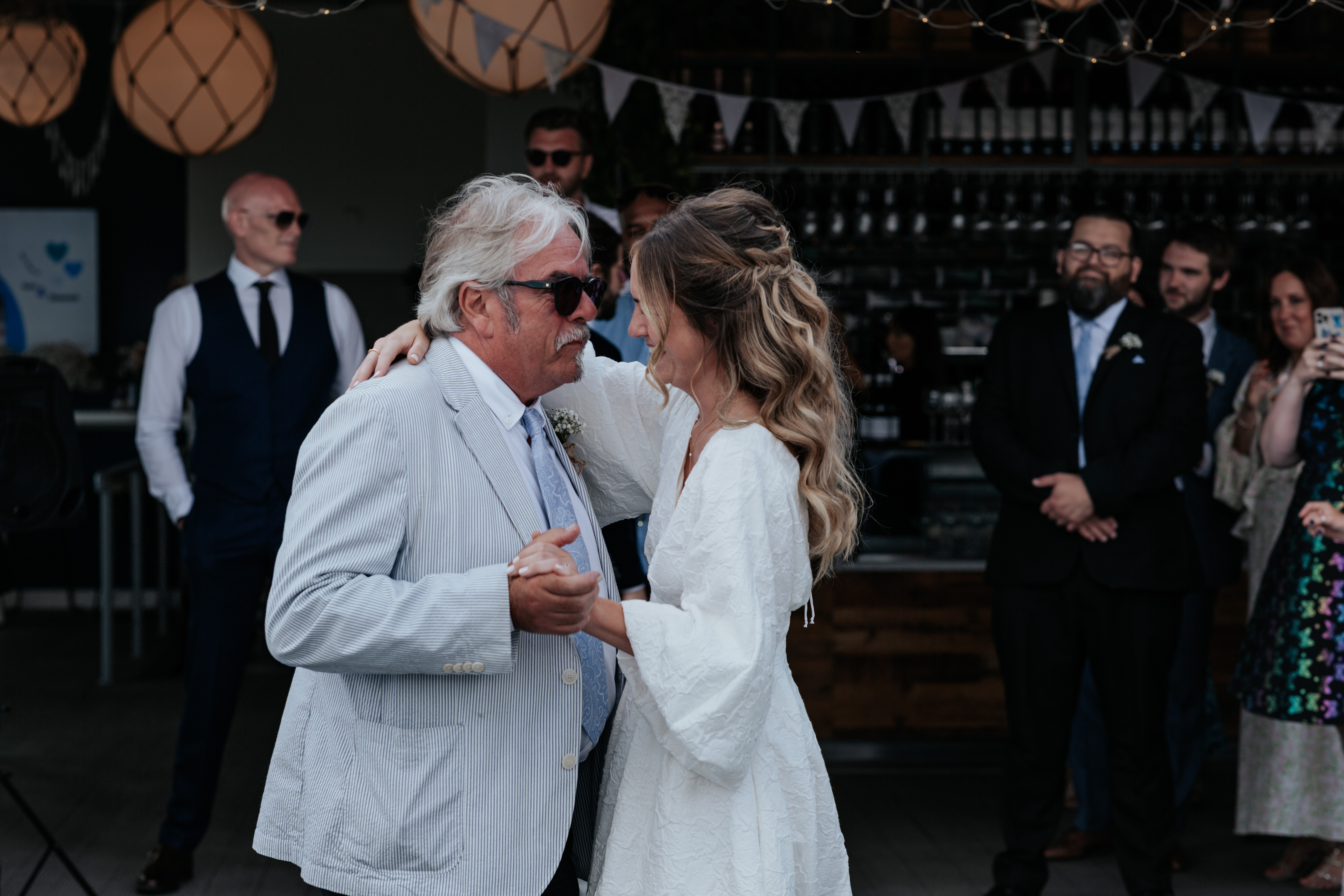 HannahSam25_07-319 Bride dances with her dad on the rooftop terrace of a London bar