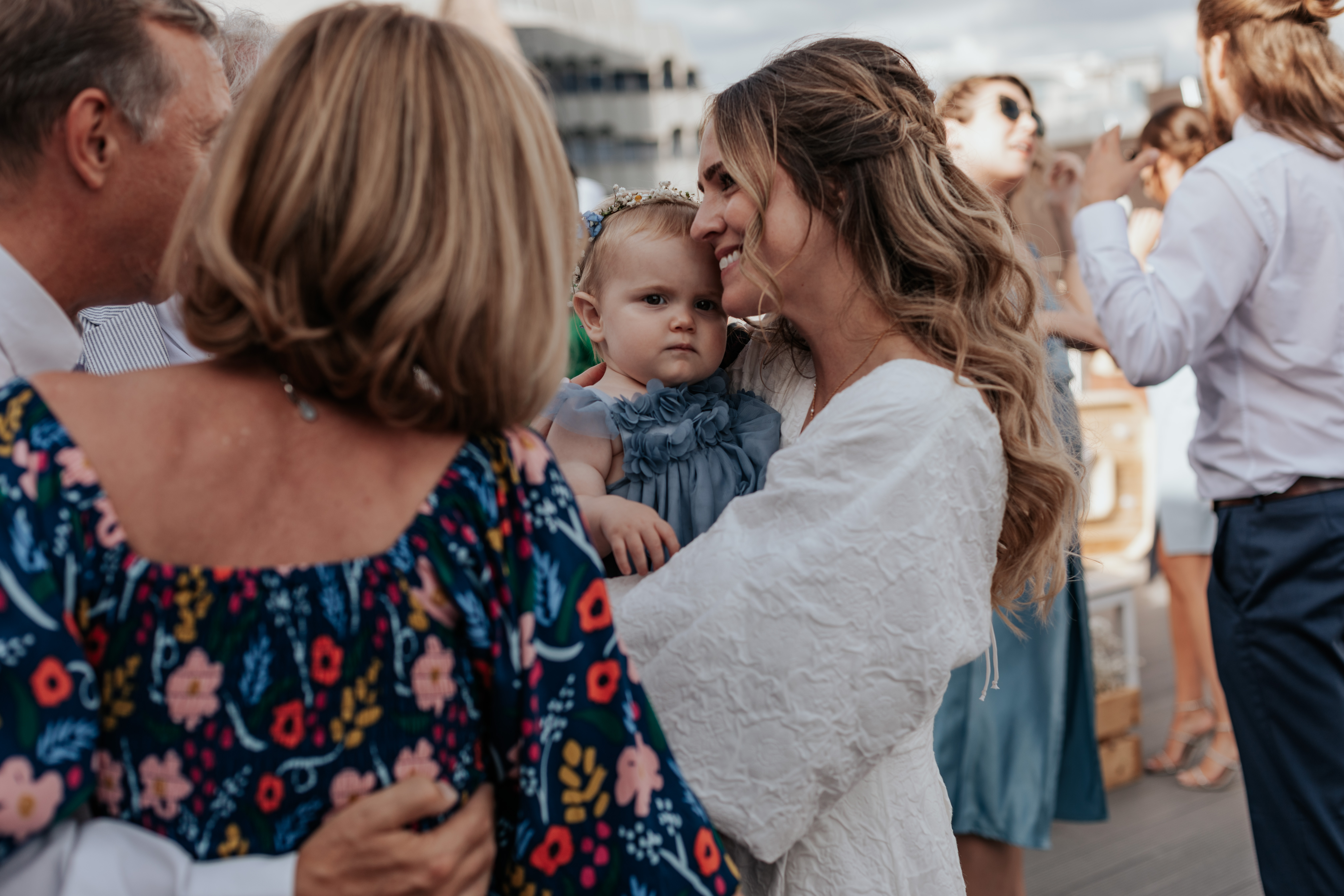 HannahSam25_07-334 Bride dances with her daughter on the rooftop terrace of a London bar