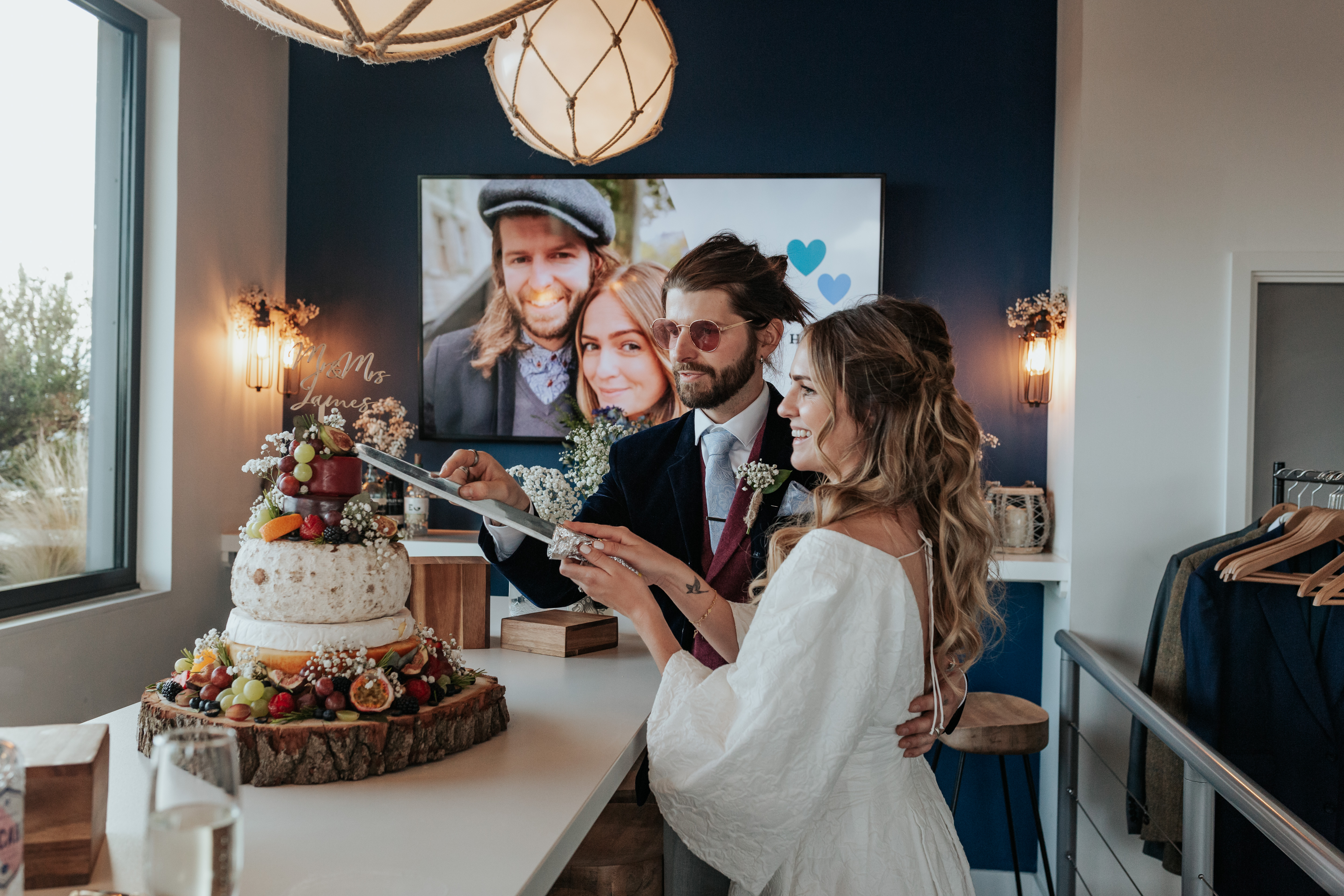 HannahSam25_07-439 Bride and groom about to cut their cheese wedding cake