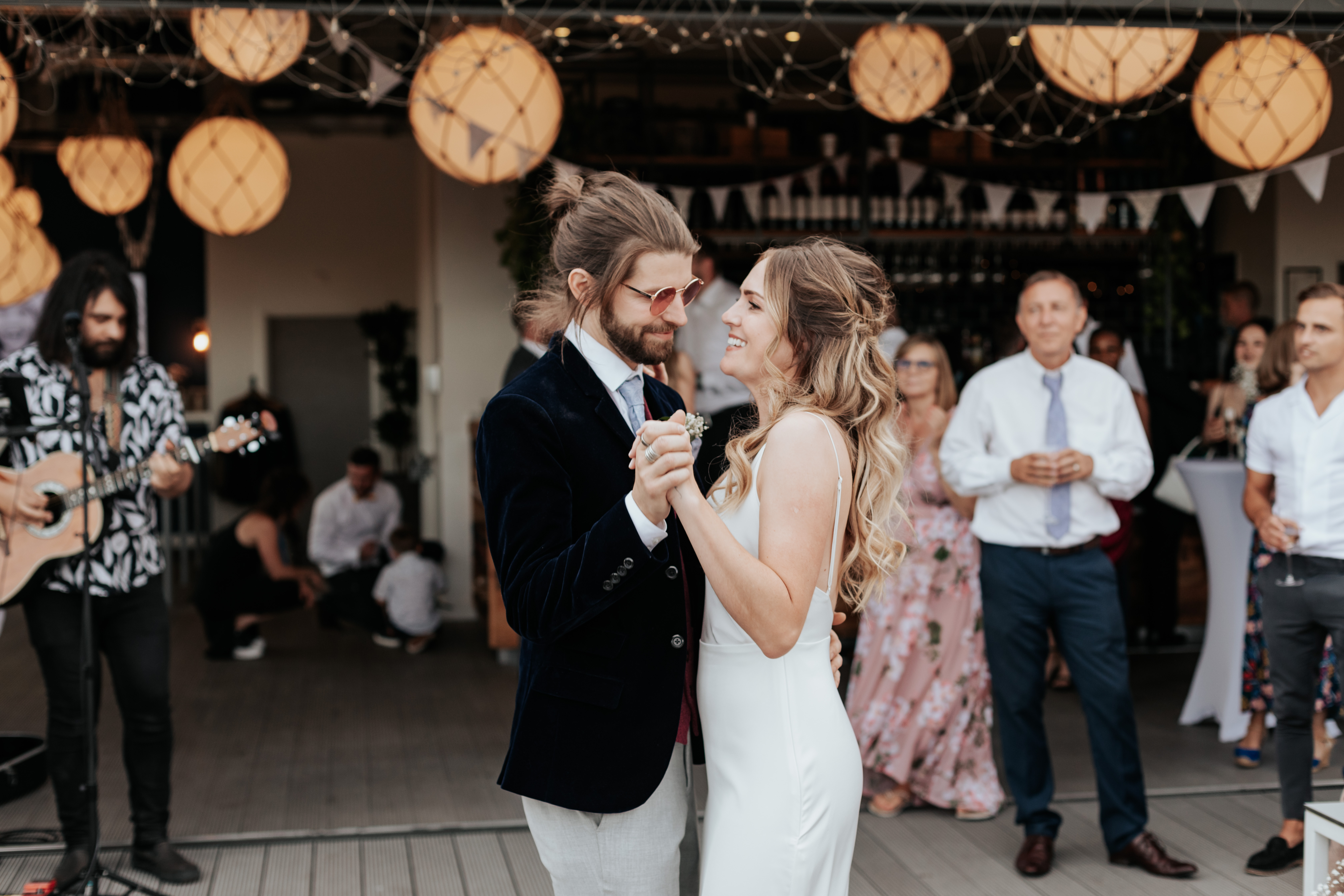 HannahSam25_07-560 Bride and Groom dance together on the rooftop terrace of a London bar