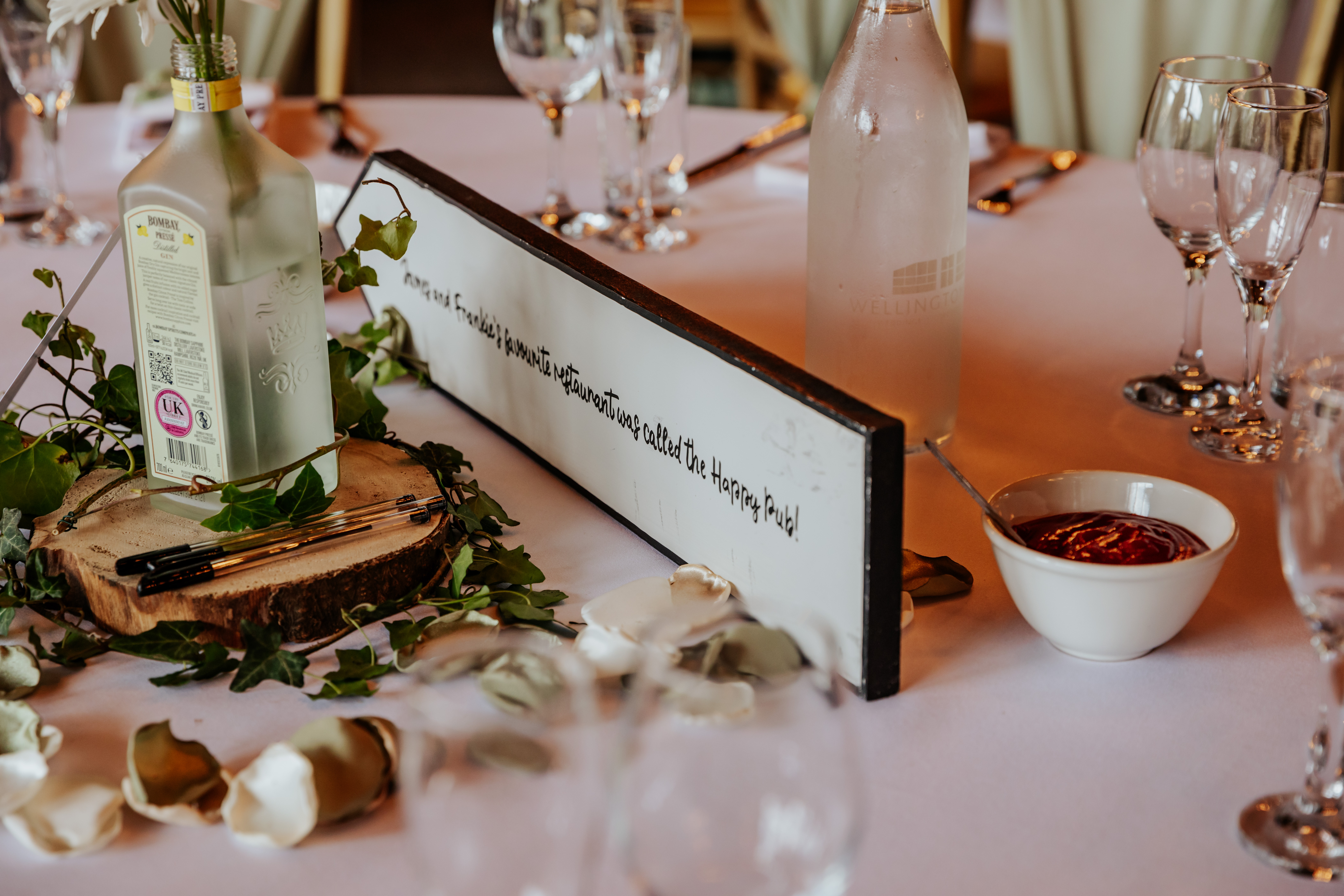 A table sign with personal trivia about the bride on the back