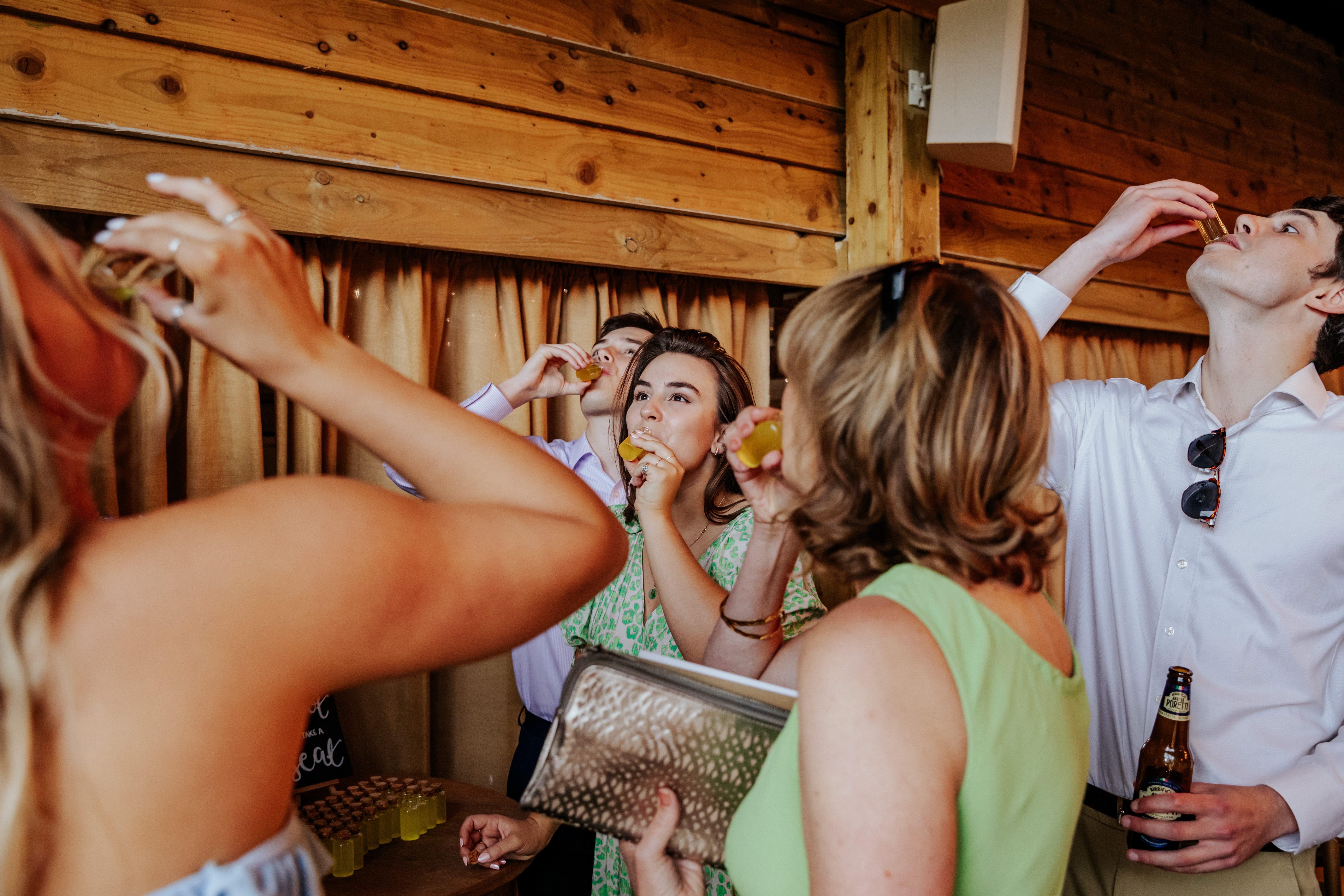 Guests take a shot of limoncello together