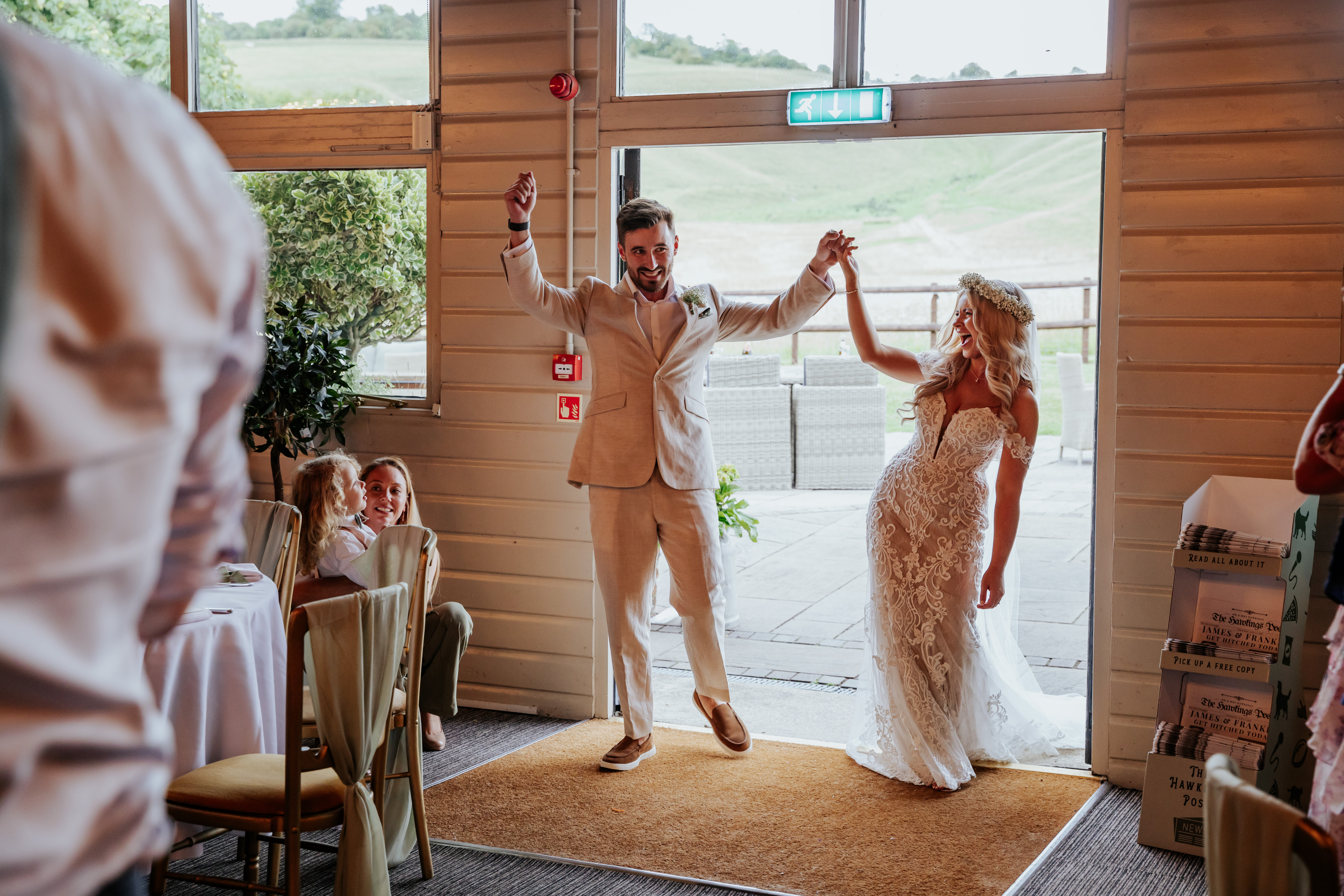 Bride and groom make their entrance into the wedding breakfast