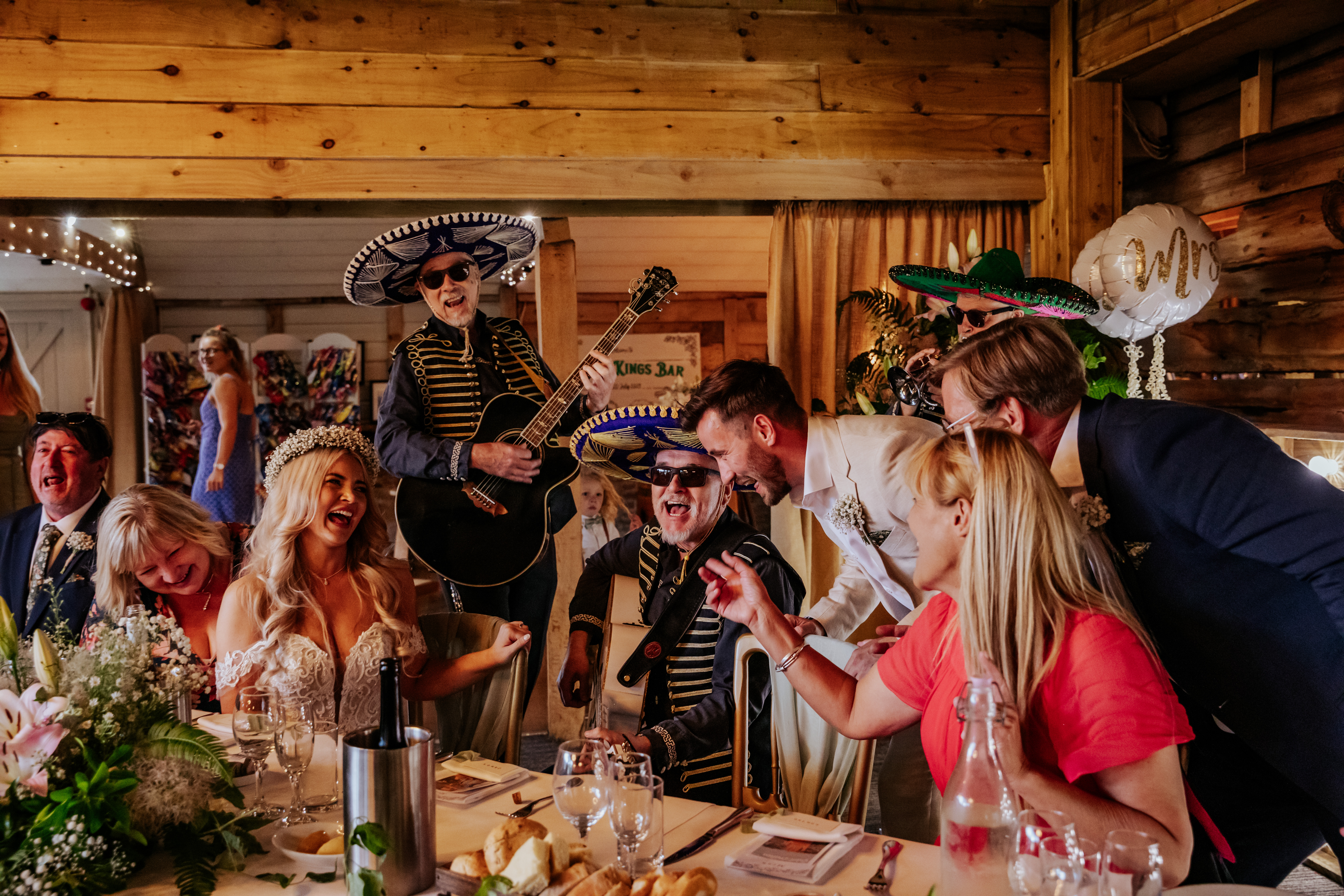The groom serenades his bride with a mariachi band
