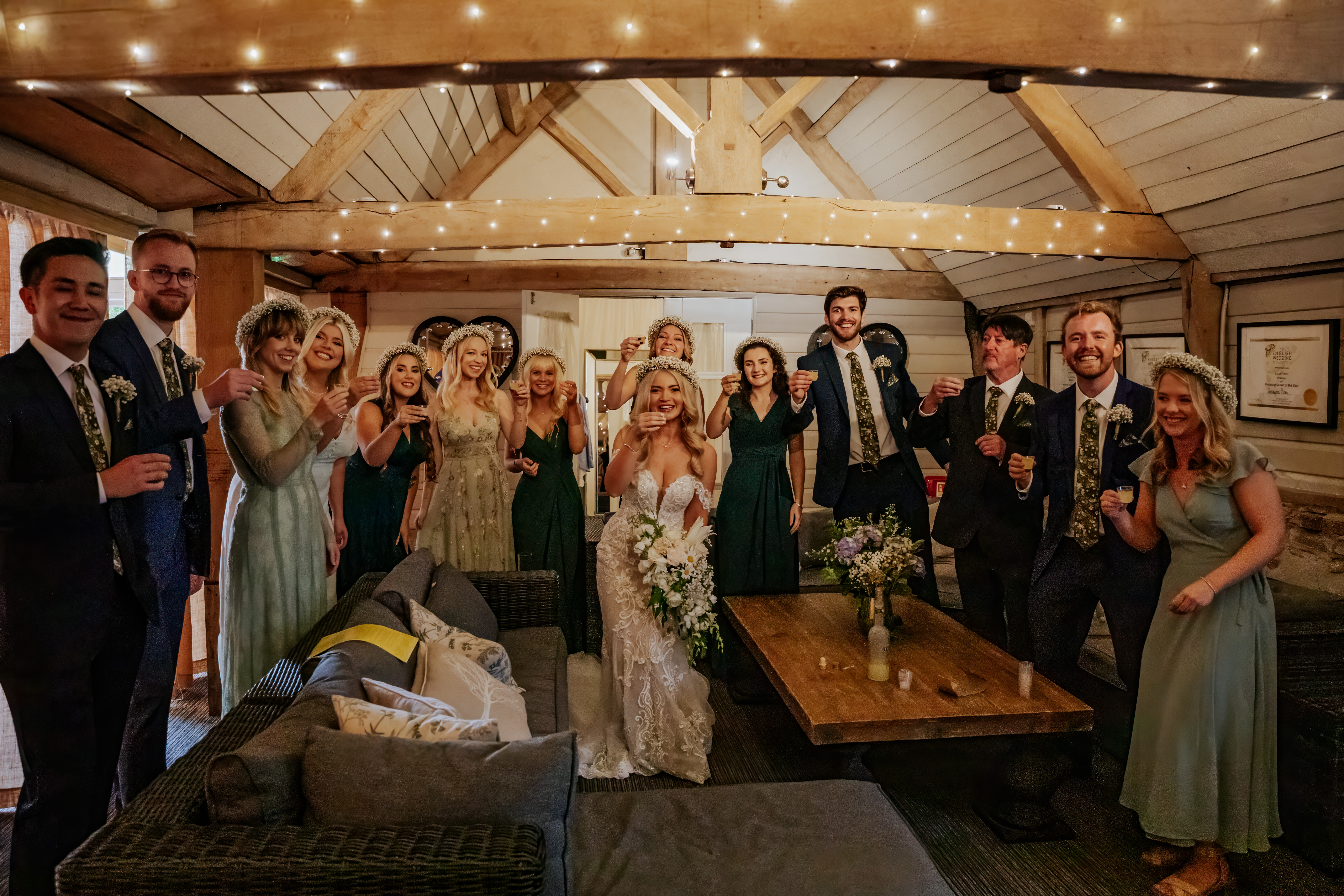 The wedding party cheersing a shot of limoncello